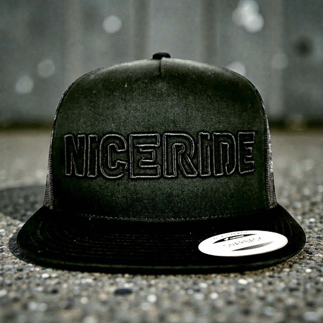 3D Blacked Out style NiceRIDE hat with black puff embroidery and raised stitching design.