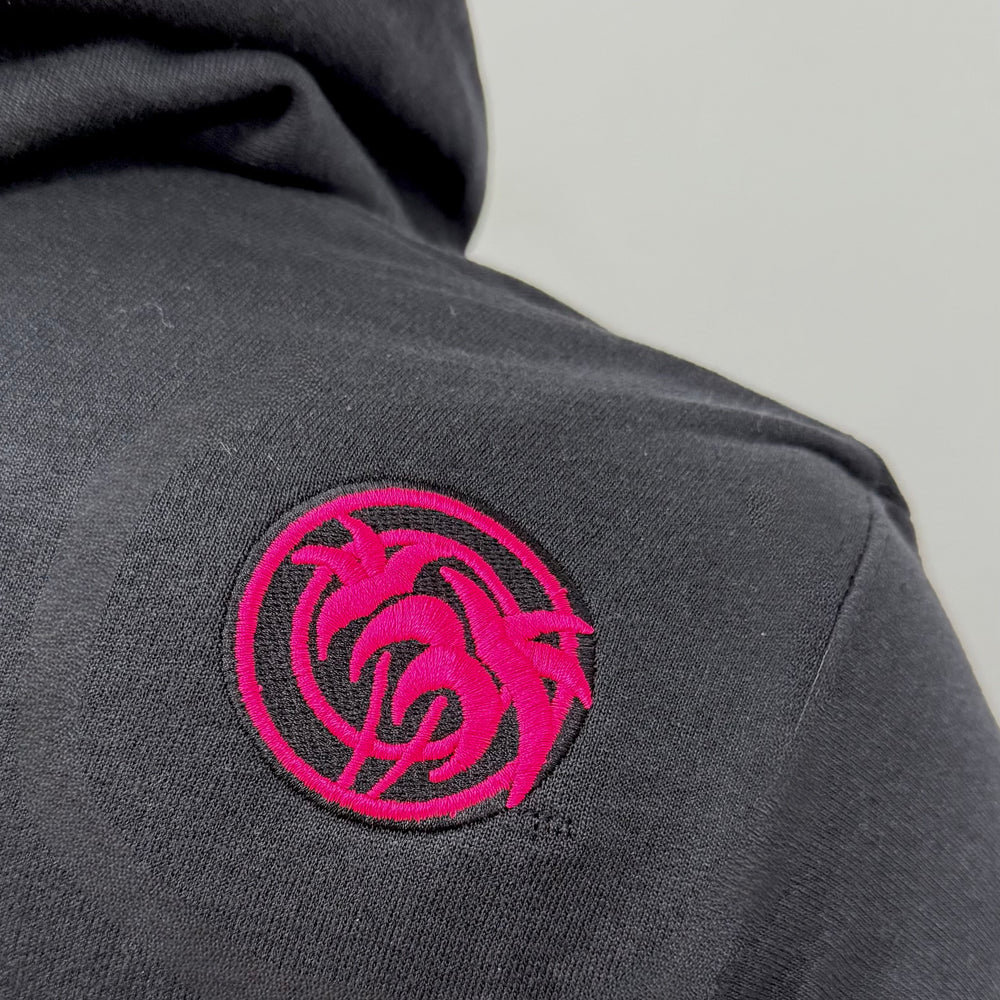 embroidered design on black comfortable unisex black hoodie by NICERIDE featuring pink palm trees logo on back shoulder