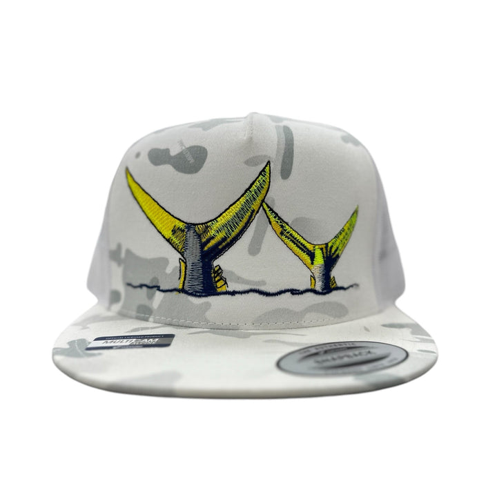 NICERIDE Tall Tails Trucker Hat with embroidered yellow whale tails on a camouflage background.