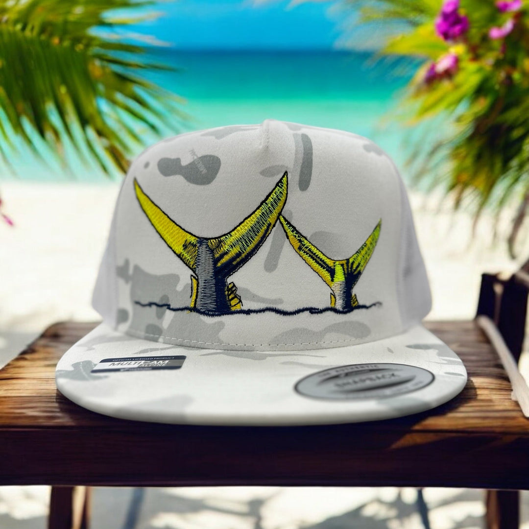 NICERIDE Tall Tails trucker hat with yellow tail design, set against a beach backdrop, unisex baseball cap.