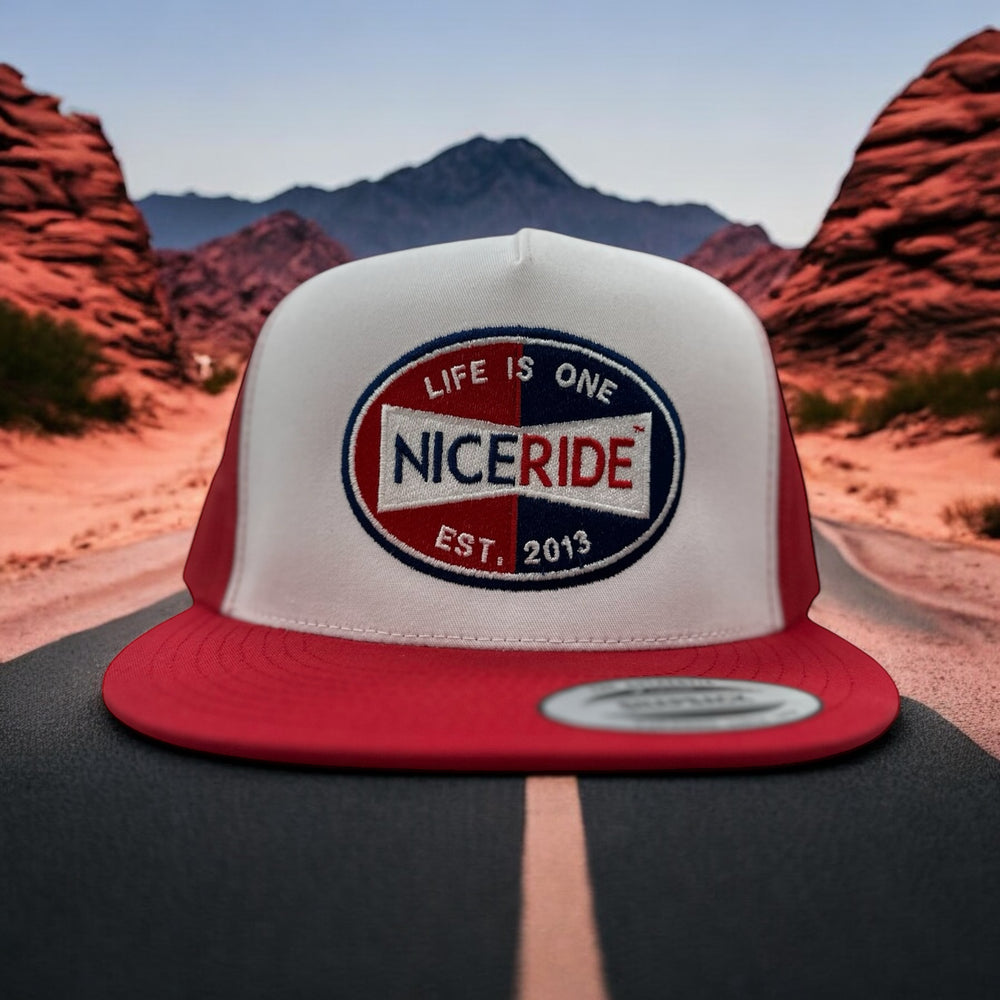 NICERIDE Champion trucker hat showcasing embroidered logo on a scenic road background, perfect unisex Hat for style and comfort.