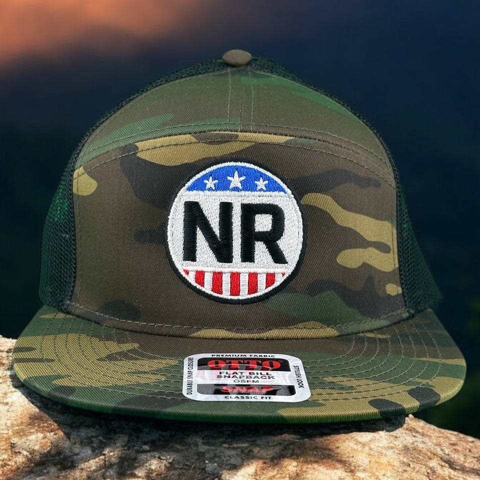 Camo and black unisex 7 panel trucker hat featuring NR logo and mesh back, perfect for stylish wear.