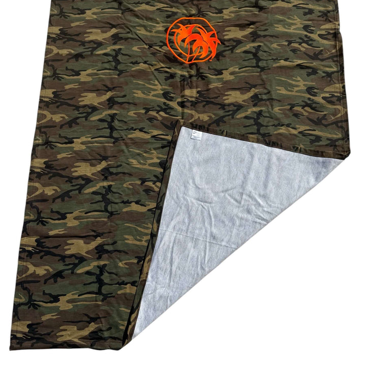 Niceride Palm camouflage fleece blanket showcasing soft interior and Classic Orange logo.