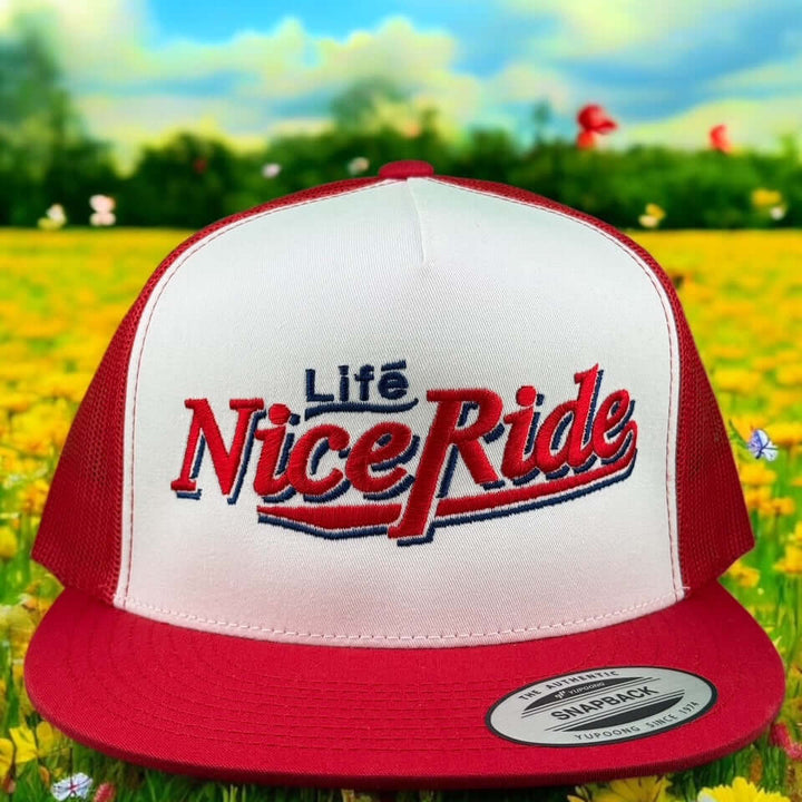 Bambino unisex adjustable trucker hat with red and white design featuring Life Nice Ride logo, perfect for casual style.