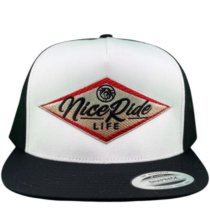 NICERIDE South Point unisex adjustable trucker hat in white and black with embroidered logo