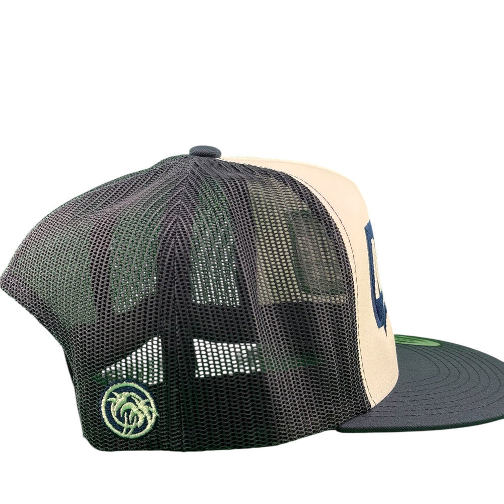 Side view of 'Ocean' 6006 unisex adjustable trucker hat with embroidered designs.