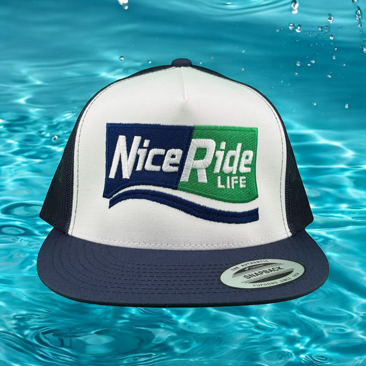 NiceRide Life unisex adjustable trucker hat in front view, with logo on a water-themed background.