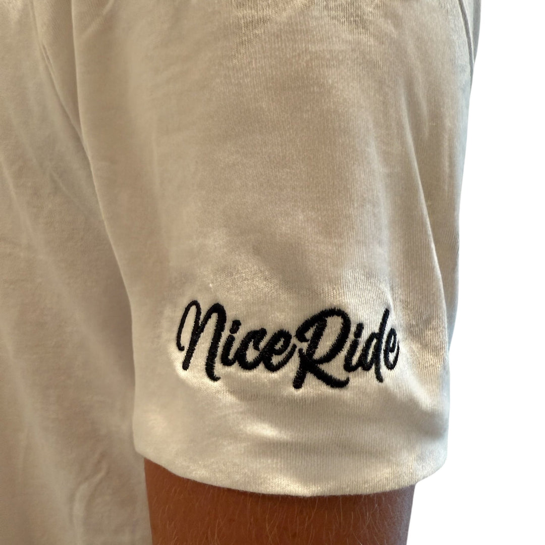 Close-up of NiceRide embroidered logo on the sleeve of a white men&