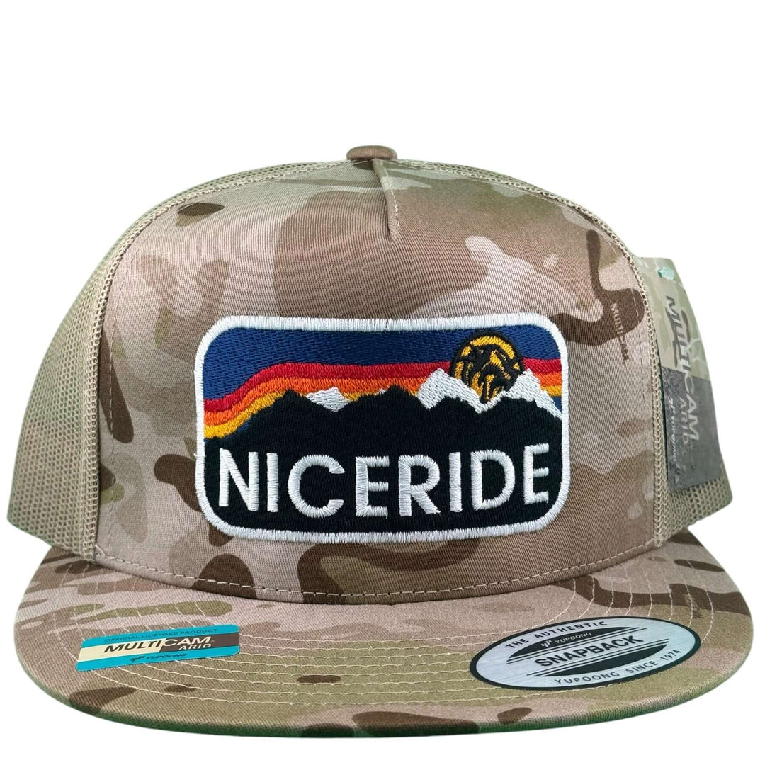 Glacier 6006 Unisex Tan camo Adjustable Trucker Hat featuring multicolor mountains and logo.