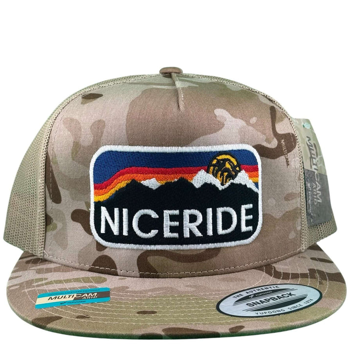 Glacier 6006 Unisex Tan camo Adjustable Trucker Hat featuring multicolor mountains and logo.