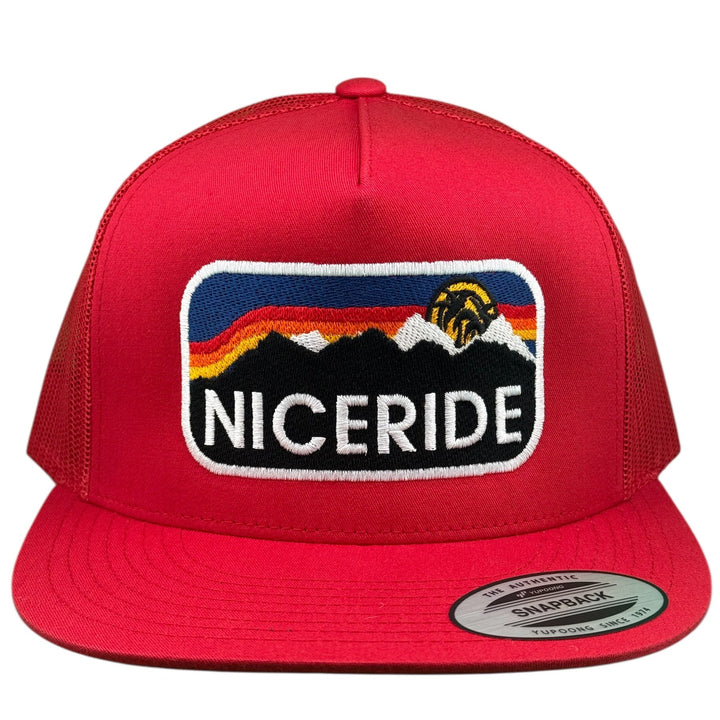 Niceride Glacier 6006 Unisex Hat front view with embroidered mountain logo on red fabric background