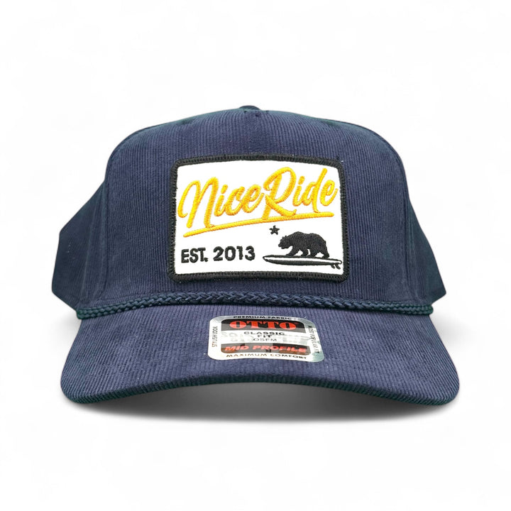 Big Sky Corduroy OTTO CAP 5 Panel Mid Profile Snapback Baseball Cap in navy with a NiceRide logo and established date 2013.