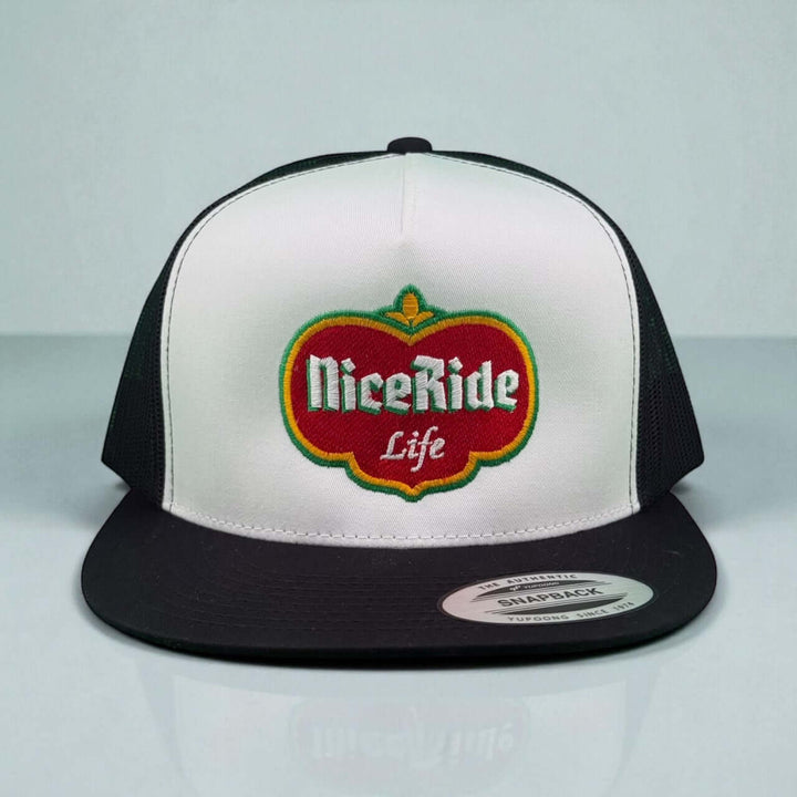 Dented unisex trucker hat featuring NiceRide Life logo in red and green, stylish snapback design.
