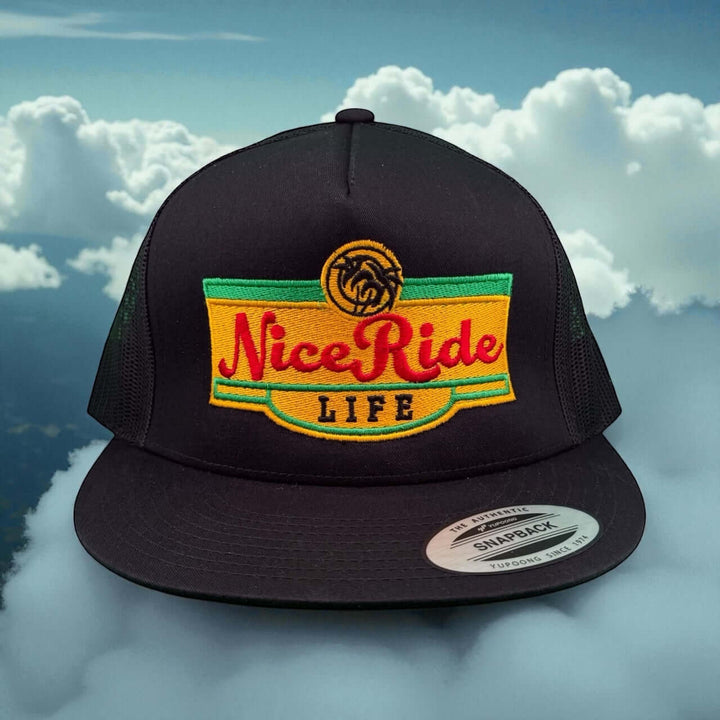 Niceride “Bubble Water” 6006 unisex snapback trucker hat with vibrant logo against a cloudy background.
