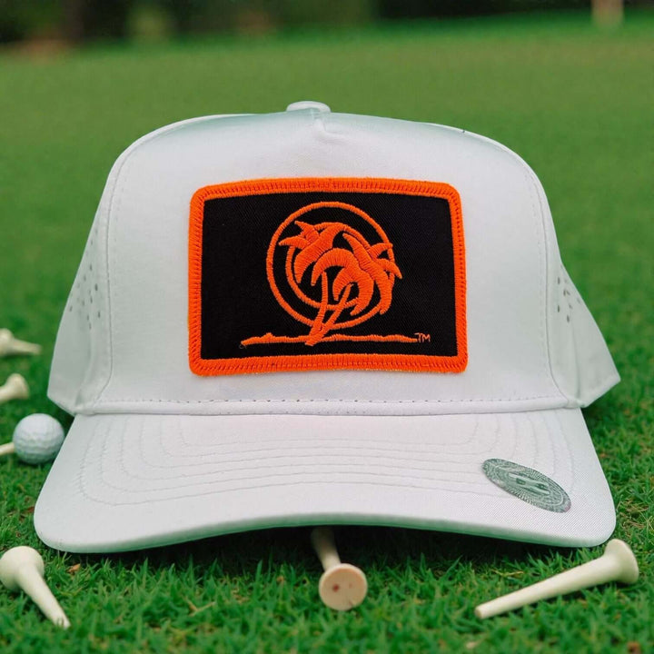 Neon Orange Palm Patch 5-Panel Performance Golf Trucker Cap featuring laser-cut mesh back and A-Frame design.