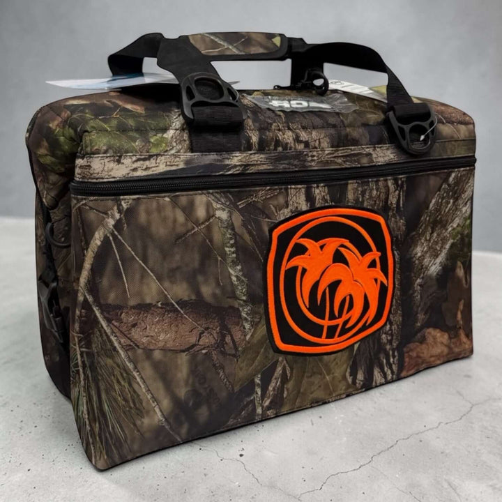 Moe Doe Soft Sided Mossy Oak cooler featuring orange logo, ideal for outdoor activities and 36-can capacity.
