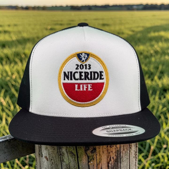 NICERIDE Windmill embroidered classic snapback trucker Hat featuring 2013 NICERIDE logo on a white and black cap.