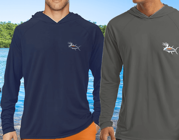 Two men wearing NICERIDE Buck-Eye UV-Protecting Long Sleeve Hooded Shirts by water, showcasing navy and gray options.