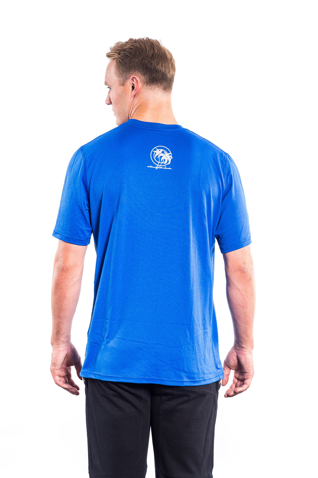 Back view of a man wearing a blue NIKE Dri-Fit shirt featuring NICERIDE&