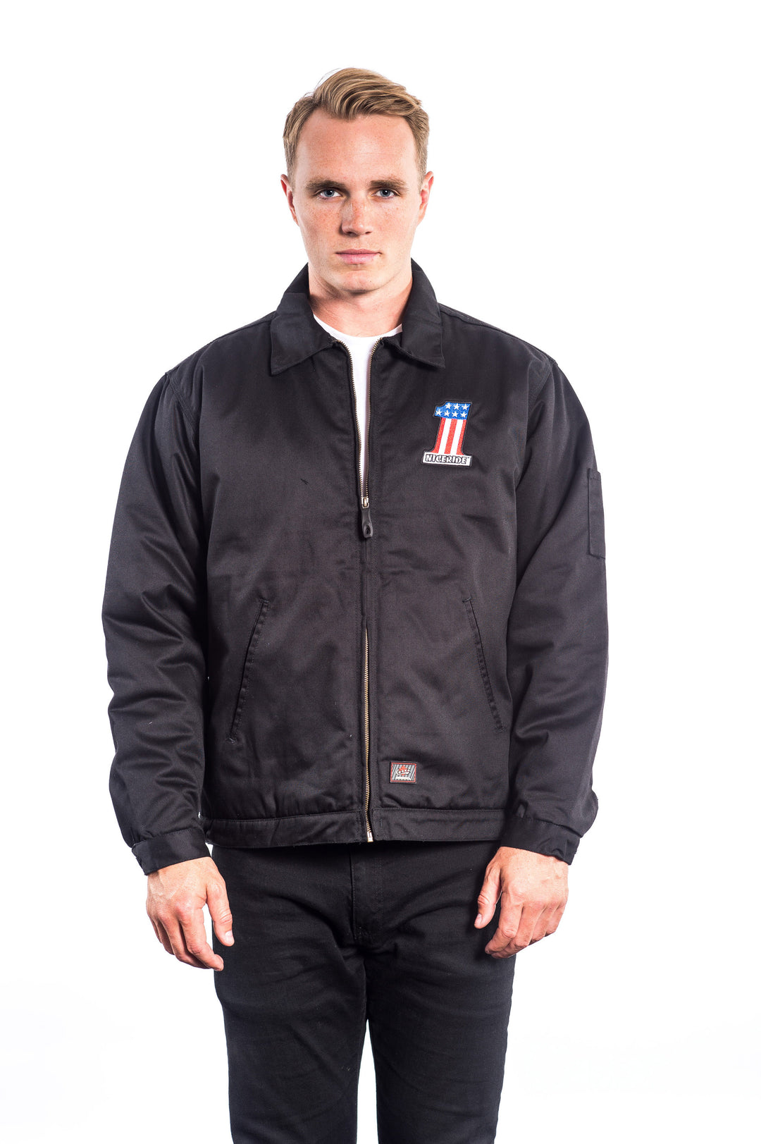 Model wearing a black canvas zip-up jacket with embroidery, showcasing the NICERIDE logo.
