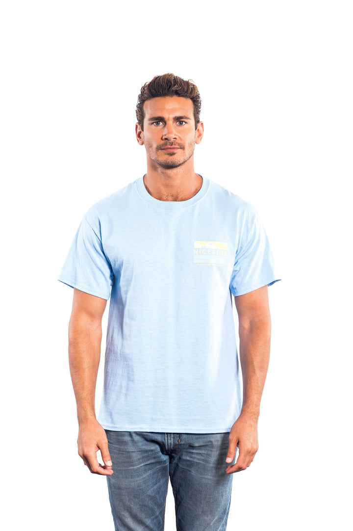 Model wearing a light blue cotton blend short sleeve shirt featuring NICERIDE&