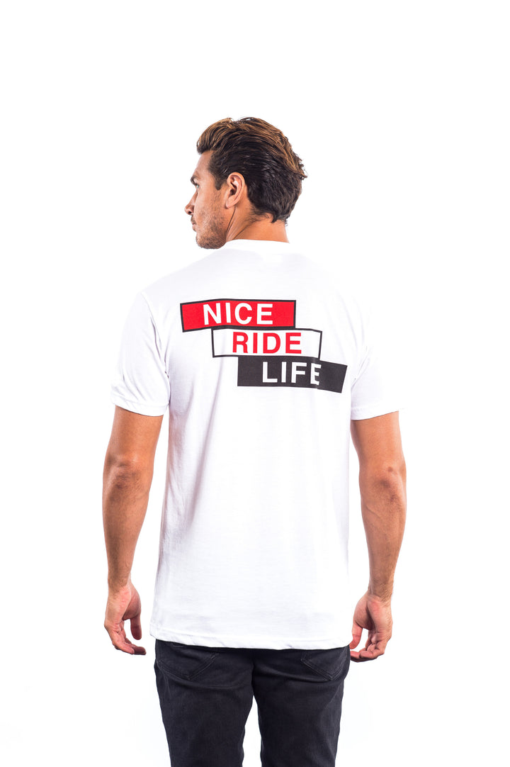 Back view of a man wearing a white shirt with &