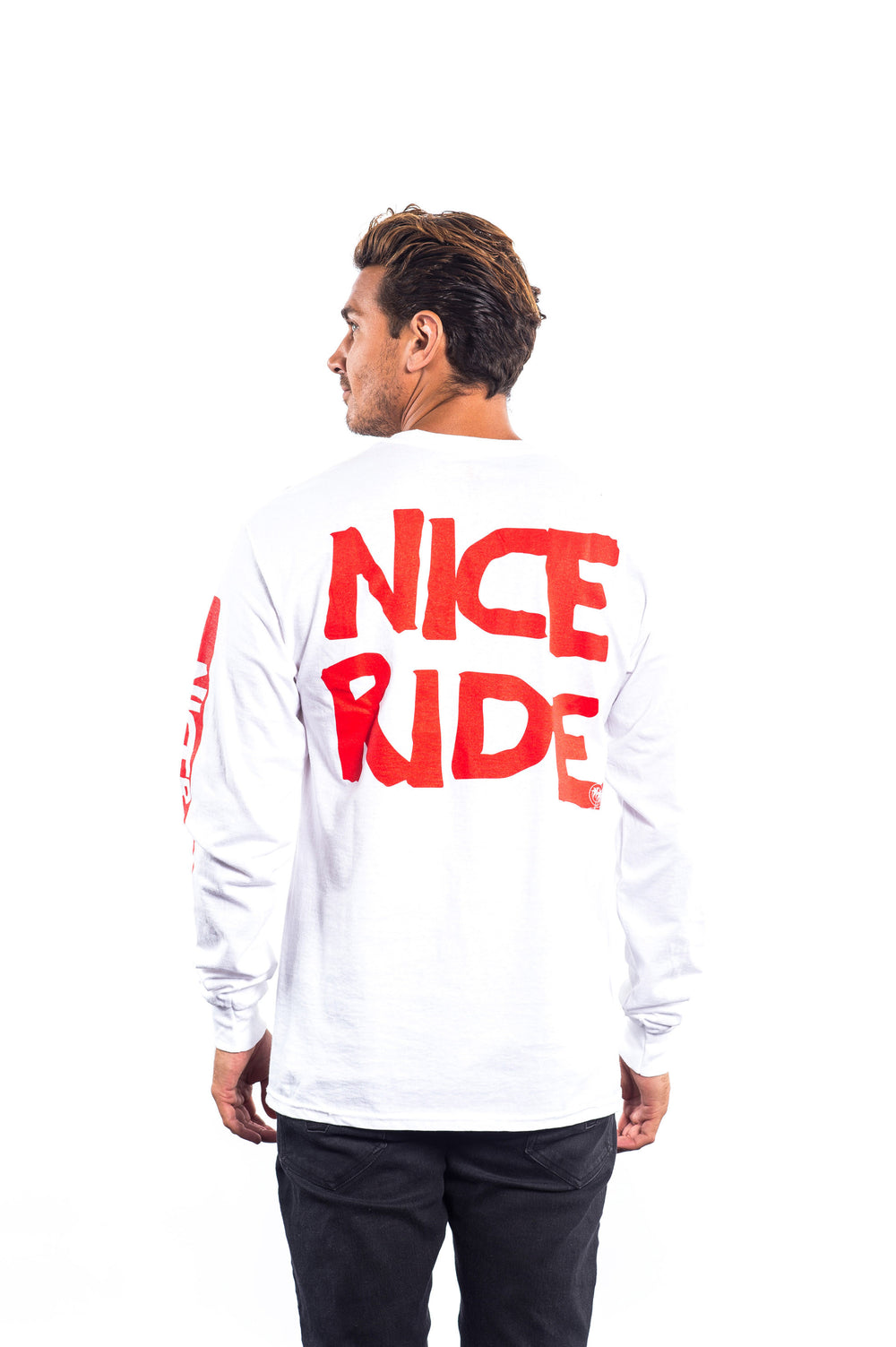 Man wearing CR RIDE shirt, a long sleeve cotton t-shirt with red lettering on the back and left sleeve.