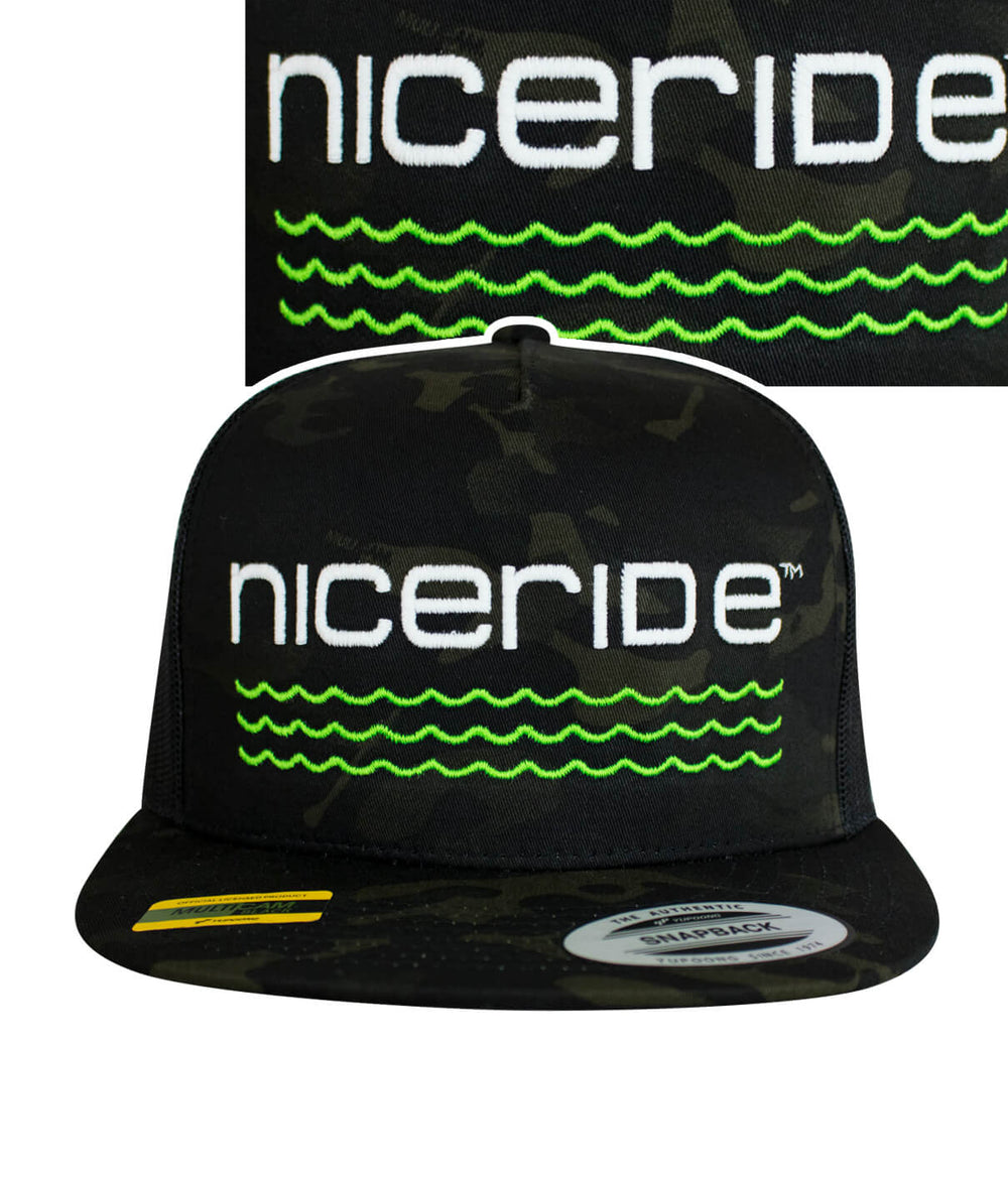 Front view of the nicoride hat featuring embroidered design and green waves, perfect for outdoor adventures.