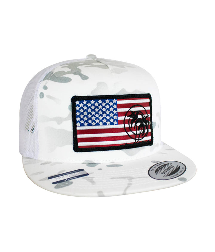 White camo trucker hat with embroidered American flag patch and black logo on front panel.