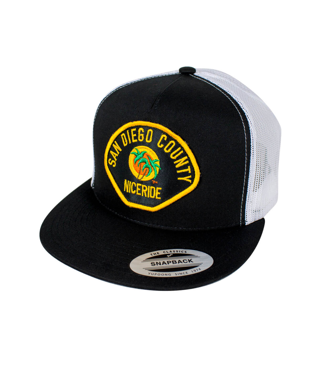 The Badge hat featuring San Diego County NICERIDE embroidered design on a black trucker cap.