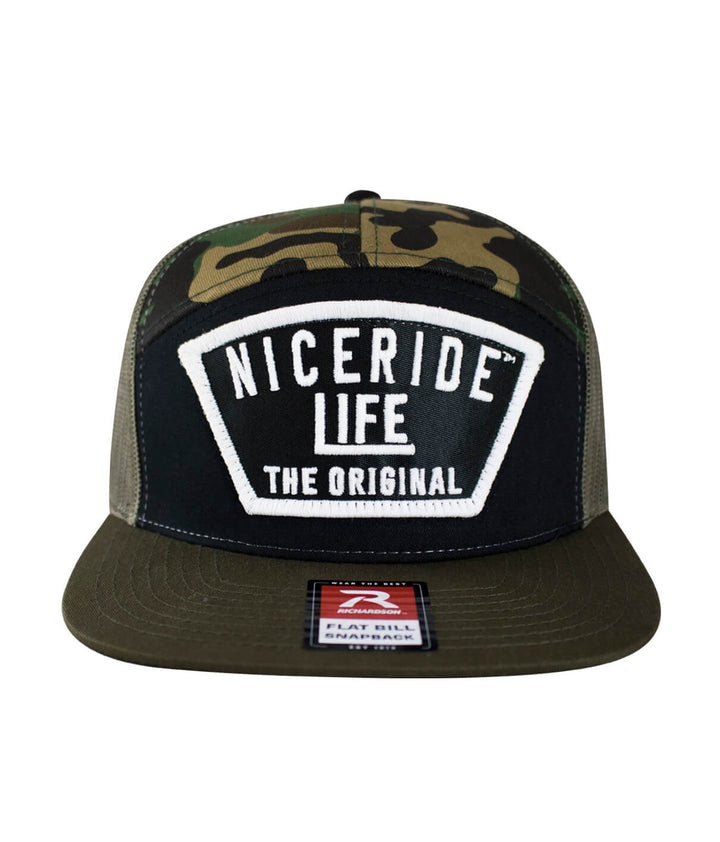 Grinder 7 Panel Trucker Snapback Hat for Men and Women with NICERIDE design, flat bill style and camouflage color.