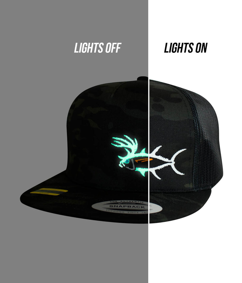 Buck-Eye LP Snapback Trucker Hat with glow-in-the-dark design, shown with lights off and on.