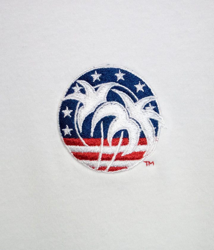 Spirit of 76 embroidered logo featuring palm trees on a circular red, white, and blue background.