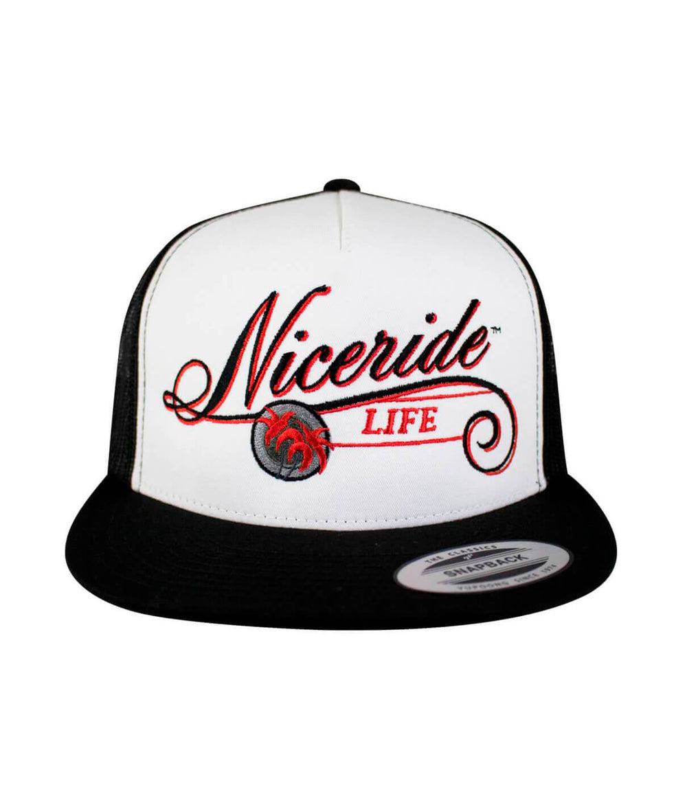 The LIFE - Red trucker hat featuring embroidered Niceriide design and black palm logo.