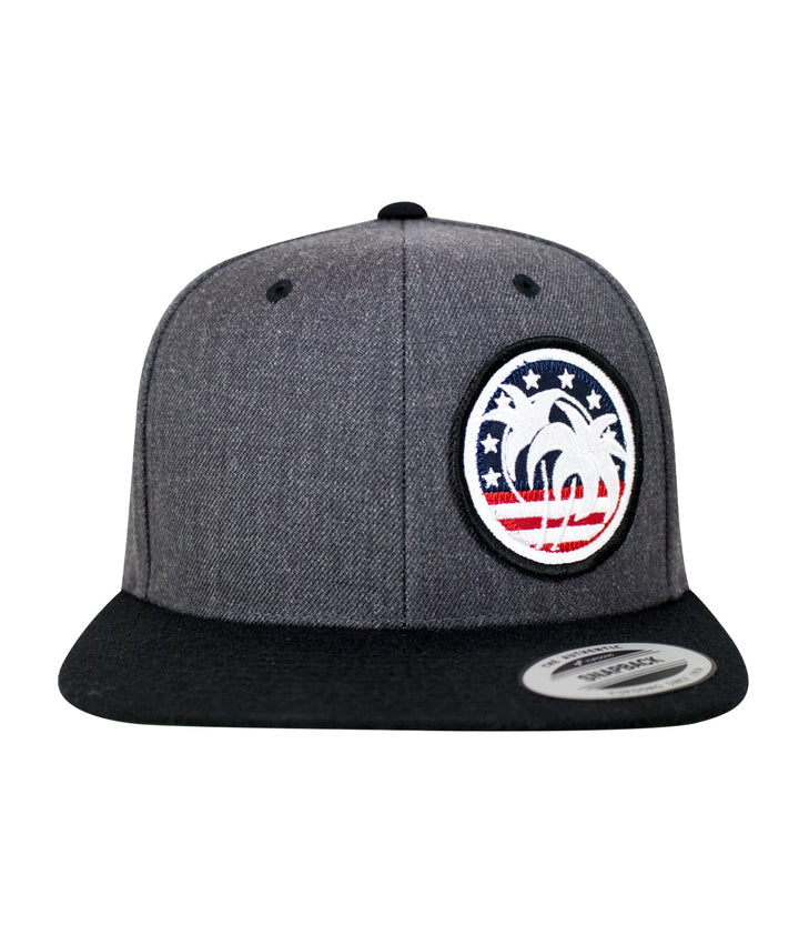 Spirit of 76 Flatbill Snapback Hat with palm tree and stars design, showcasing patriotic colors.