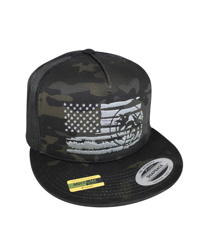 Strong Faded Trucker Hat featuring an embroidered design and a camouflage pattern with an American flag.