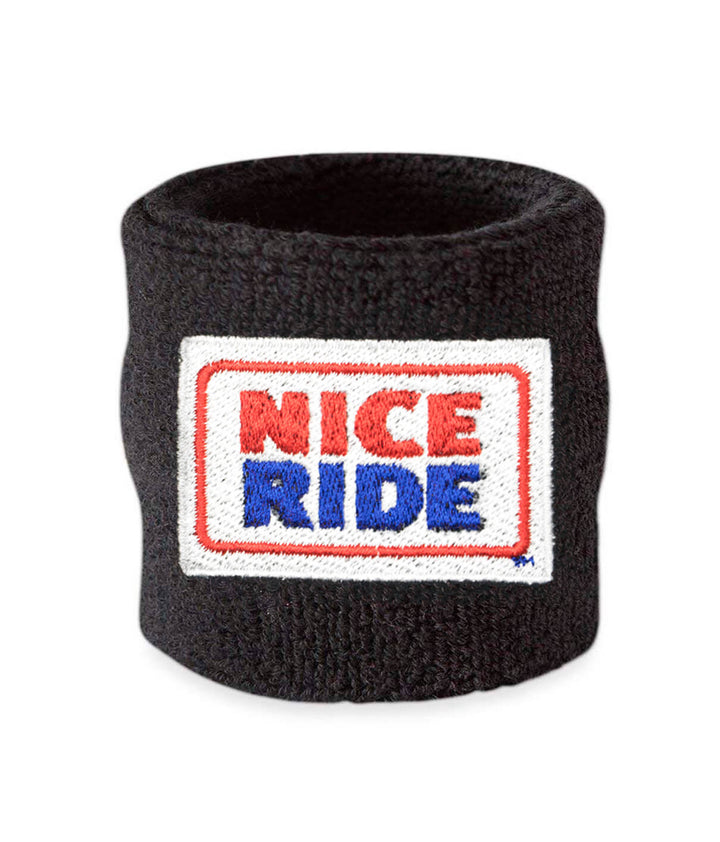 Black wristband with NICERIDE logo embroidered for sweat absorption during sports or workouts.
