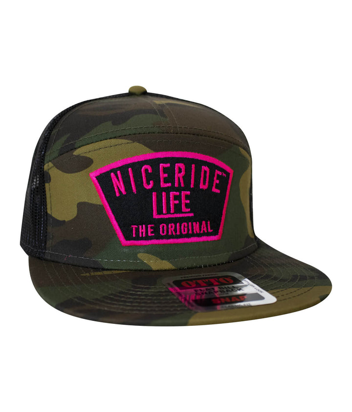 NICERIDE camo trucker hat with bold pink "LIFE THE ORIGINAL" patch on front.