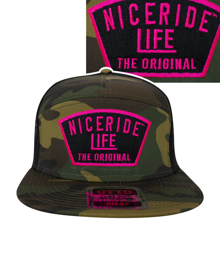 NICERIDE Grinder unisex 7 panel trucker hat in camouflage with bold pink logo and mesh back.