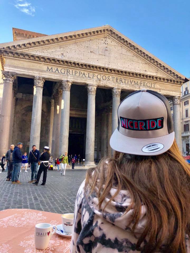 Person wearing a NICERIDE hat in front of the Pantheon in Rome, showcasing the stylish design of the hat.