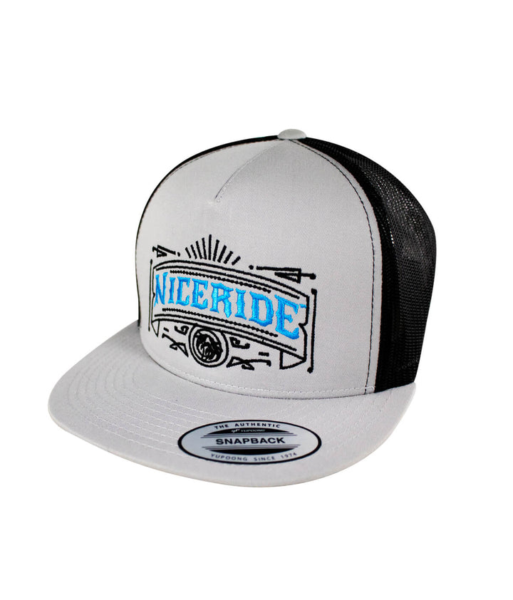 Cholo trucker hat featuring NICERIDE design in blue embroidery on a classic snapback style.