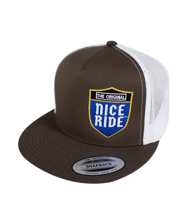 Majesty hat featuring NICERIDE embroidered design on a brown and white trucker style snapback.