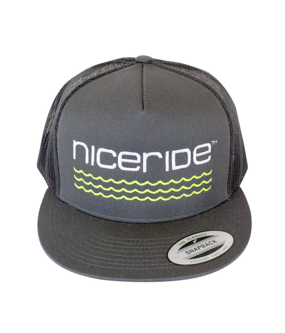 On The Water - Center Charcoal Trucker Hat by NICERIDE, classic snapback design featuring wave logo.