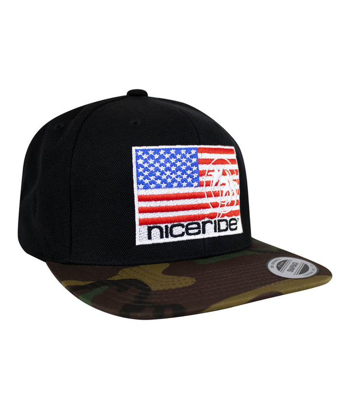 NICERIDE PRIDE camo flatbill snapback hat featuring American flag embroidery and black palm logo.