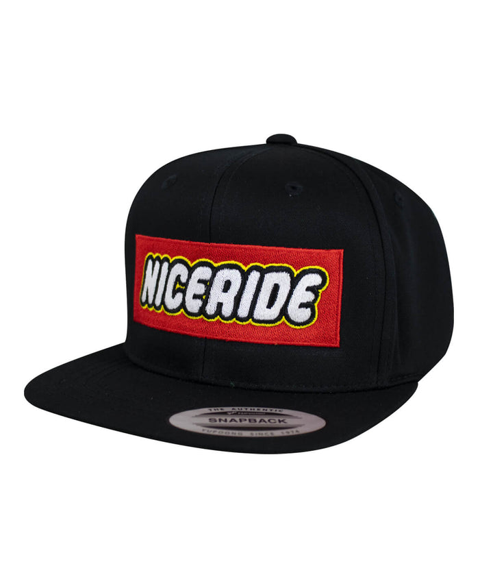Youth snapback hat featuring NICERIDE logo embroidered on front in vibrant colors.