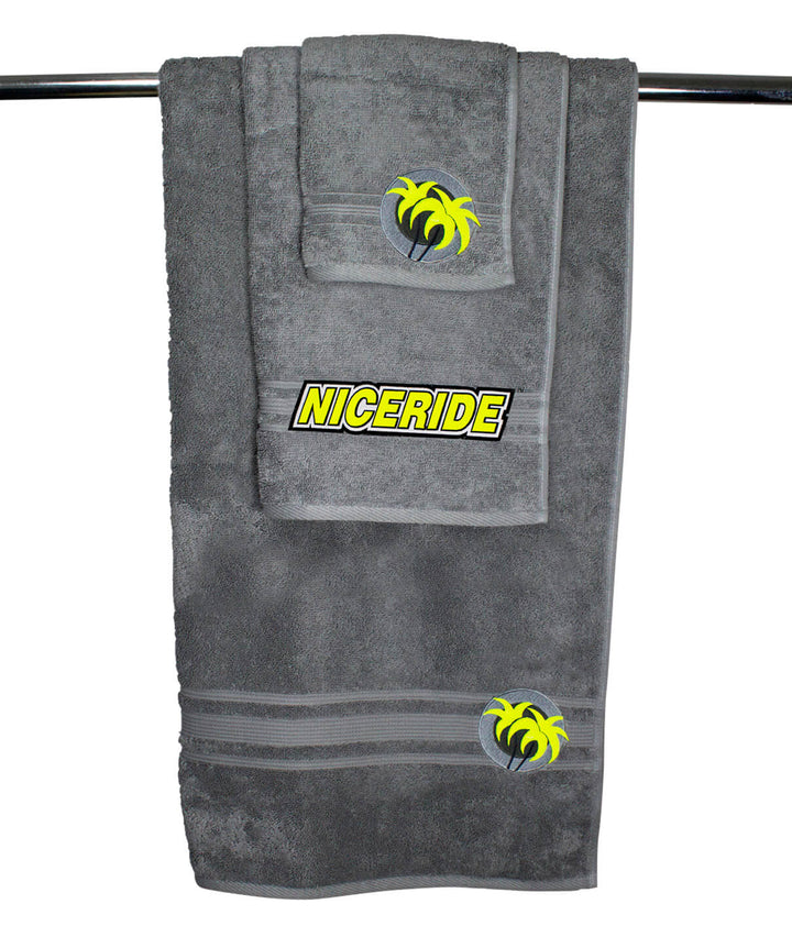 Soft gray towel set including a body towel and hand towel with embroidered design, perfect for home use and luxury.