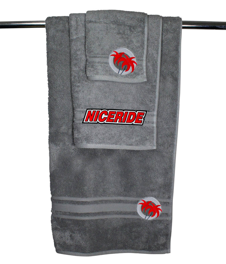 Slick 3 Piece Towel Set featuring a gray oversized body towel, hand towel, and wash cloth, ideal for comfort and style.