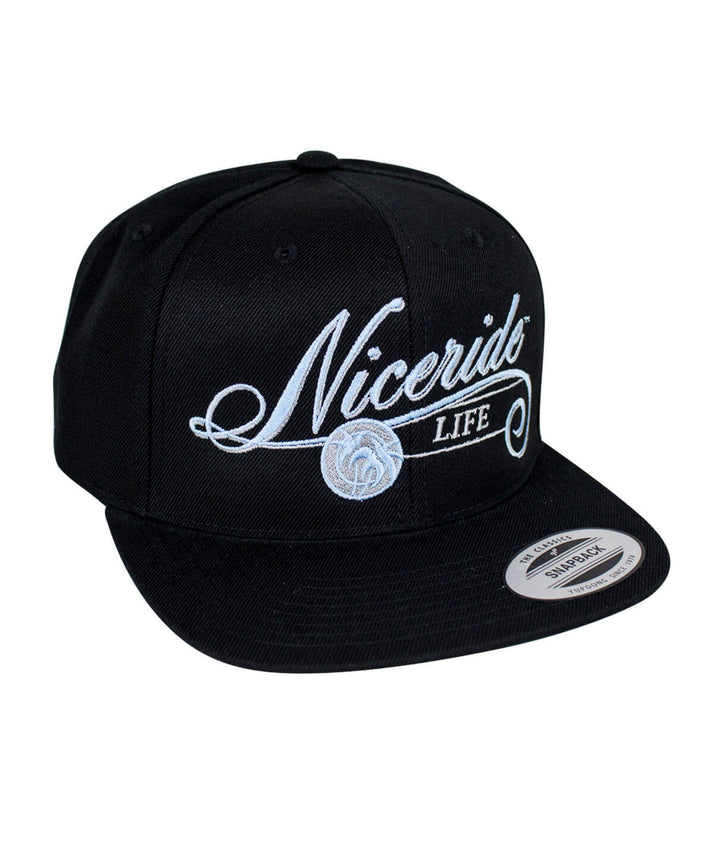 The Life snapback hat featuring embroidered NICERIDE design and palm logo, a stylish baseball cap.
