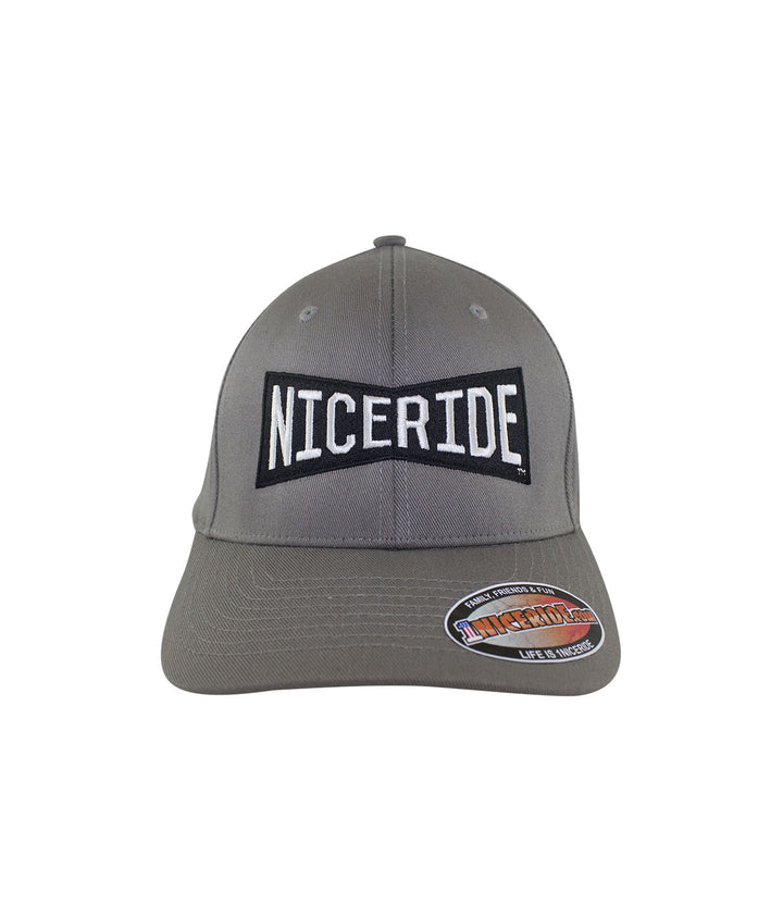Classic Flexfit hat featuring NICERIDE logo on front panel, a stylish accessory for any wardrobe.