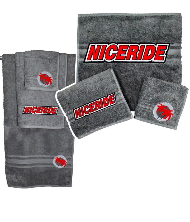 Slick 3 Piece Towel Set featuring soft gray towels with embroidered NICERIDE logo for ultimate comfort.